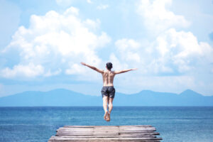 Diving into a blue lake